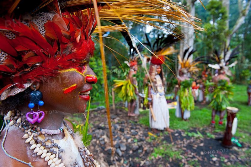 Tribe with colourful decorations and face paint is celebrating at the traditional Sing Sing gathering in the highlands