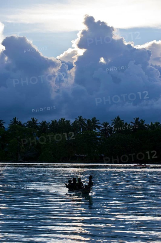 Boys in a canoe in the Marovo Lagoon