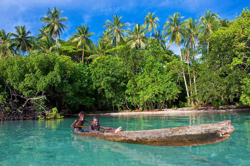 Local boys in a canoe in the Marovo Lagoon
