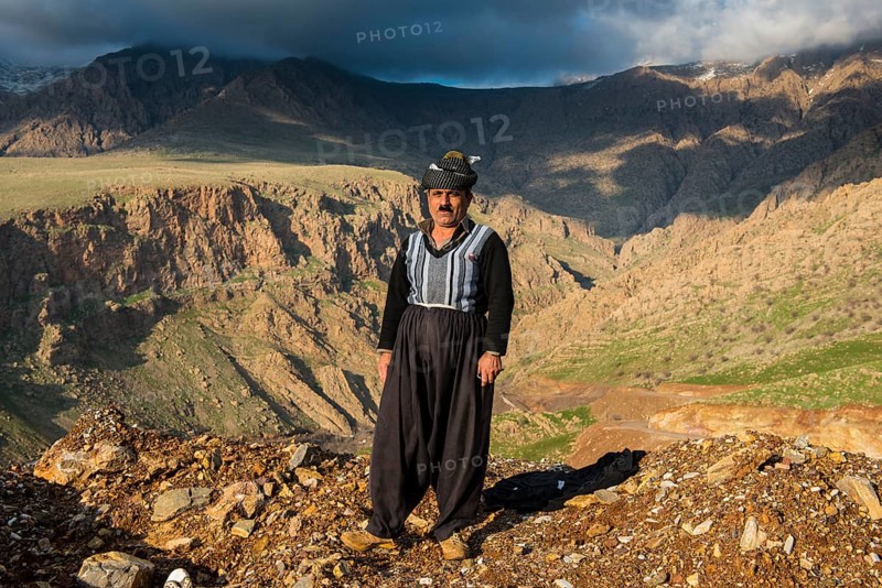 Kurdish shepherd standing on the edge of a canyon right above Ahmed Awa