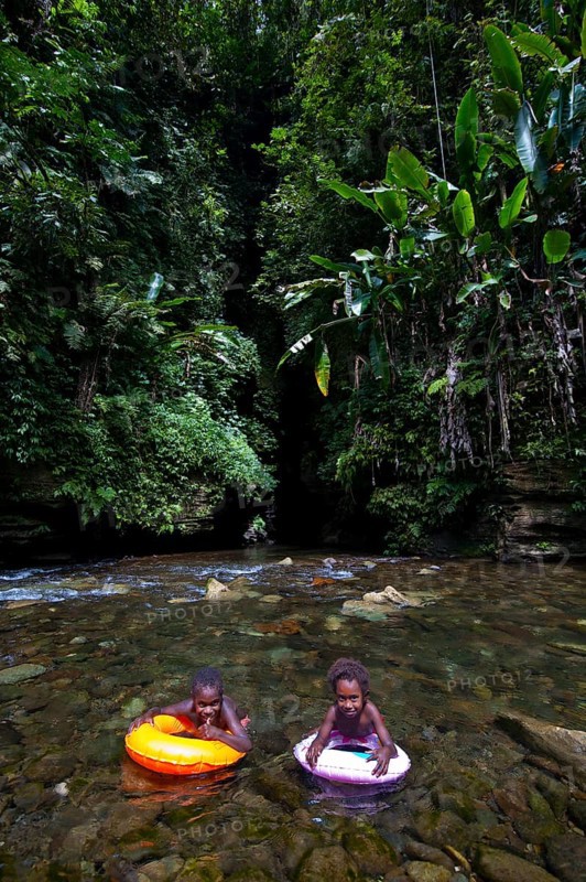 Children bathing in front of the Millennium Cave