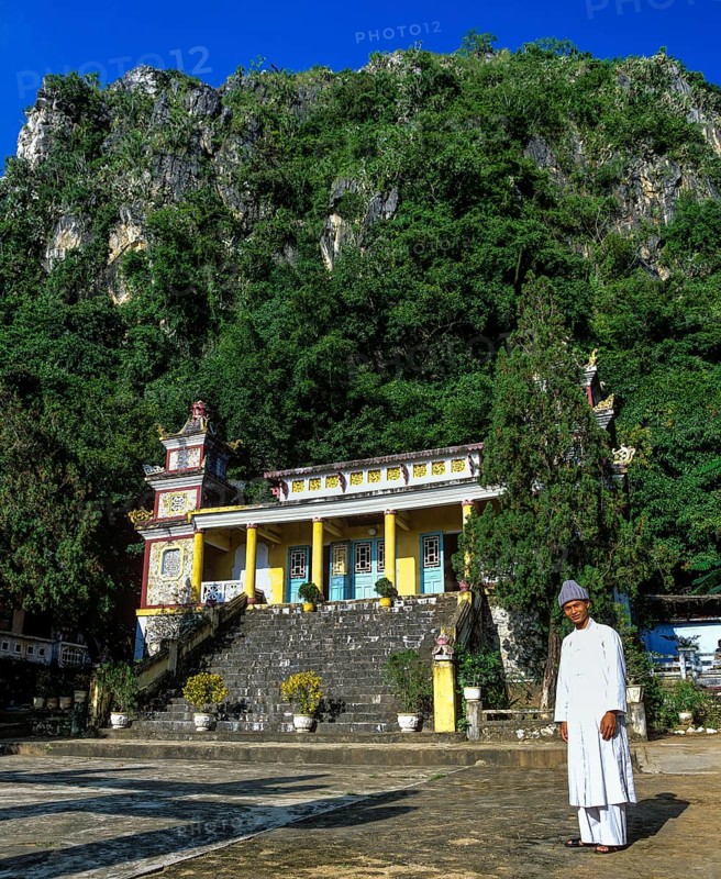 Monk in front of An Quang Pagoda in the Marble Mountains