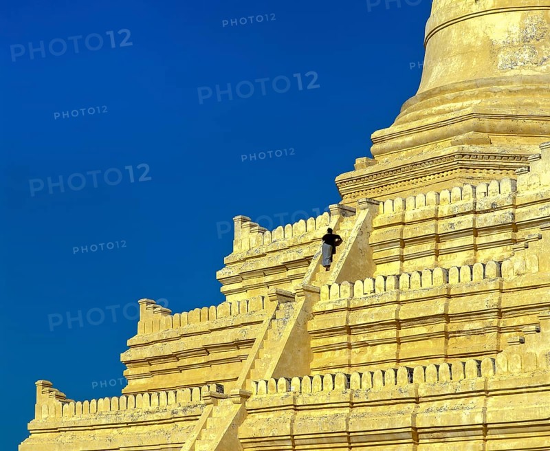 Man on the stairs of Shwesandaw Pagoda
