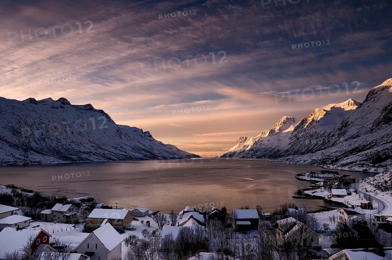 Fjord with small town in the evening light