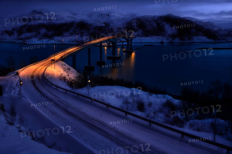 Bridge with fjord by moonlight