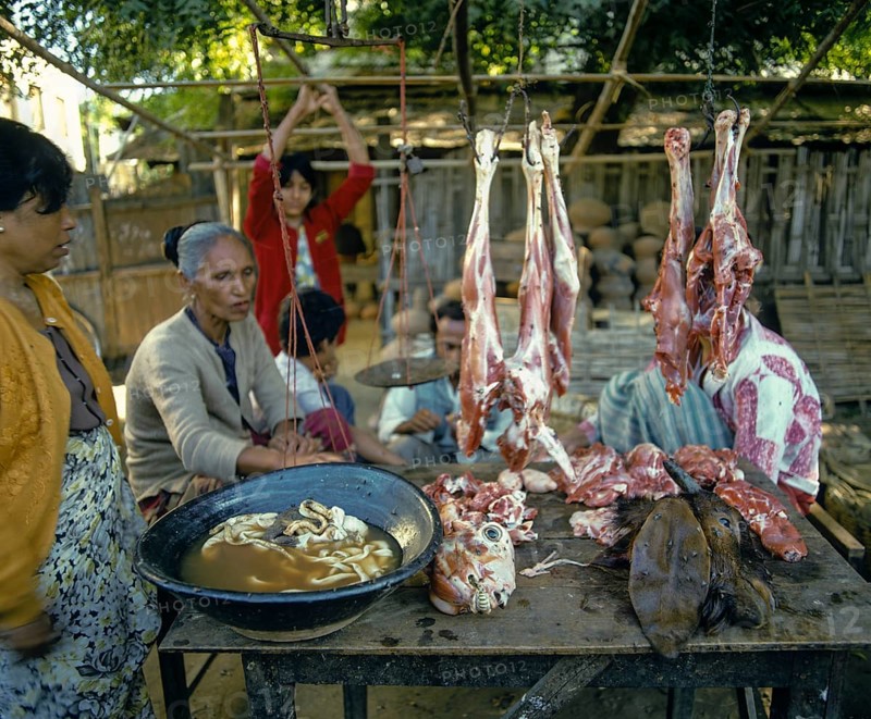 Woman selling meat at a market