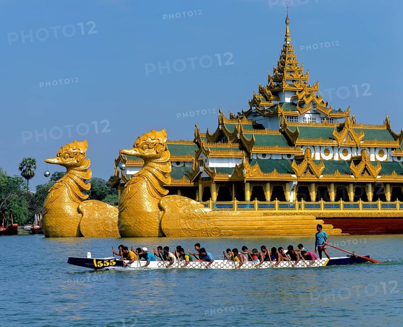 Dragon boat on Lake Kandawgyi in front of the Karaweik ship restaurant