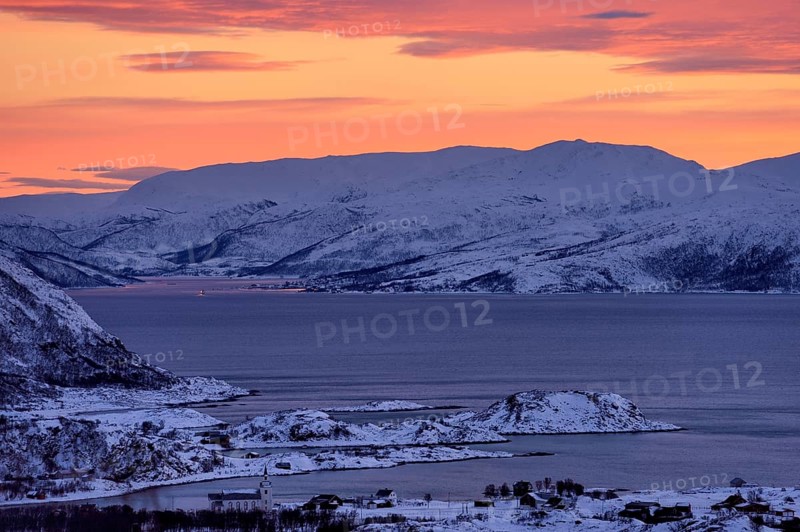 Fjord with islands in winter at sunset