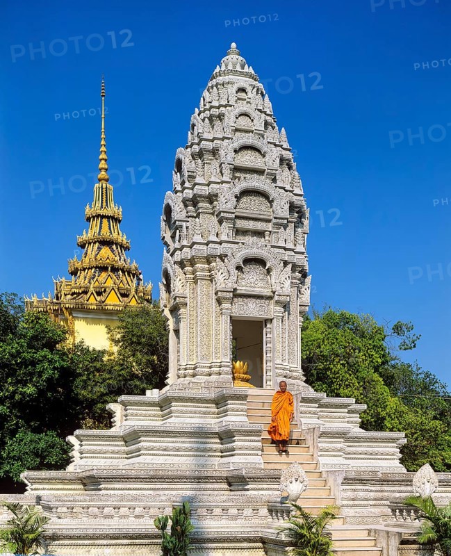 Monk on the stairs at the Kantha Bopha Stupa at the Silver Pagoda