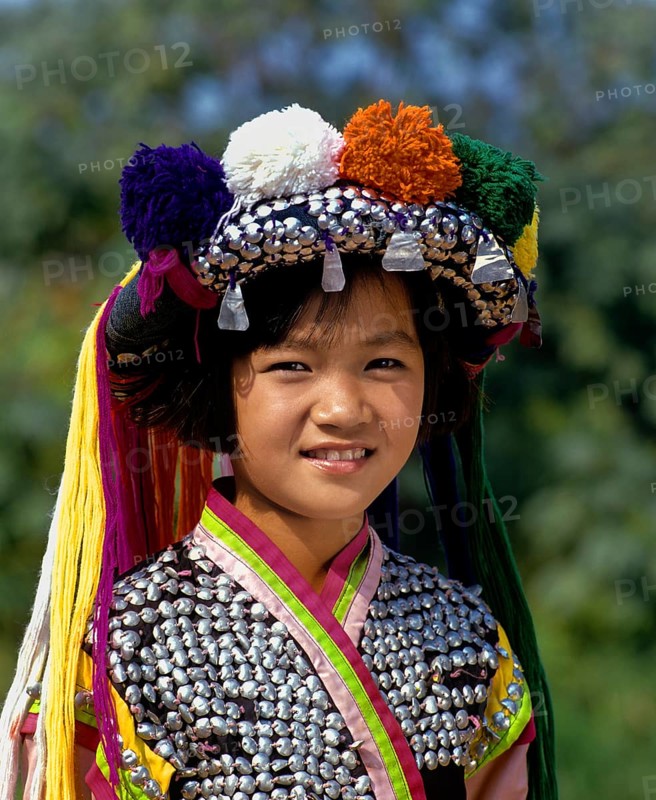 Lisu girl wearing a colourful headdress and the traditional costume of the mountain people
