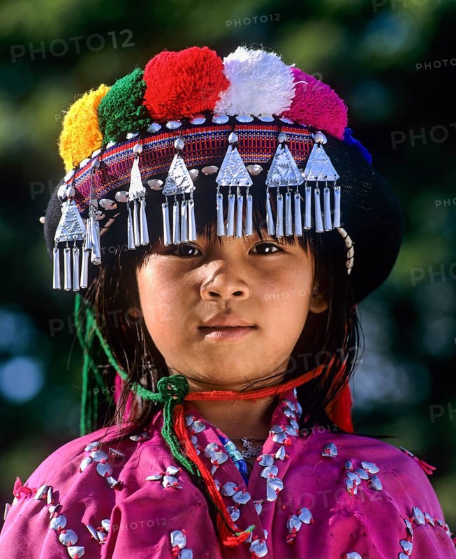 Lisu girl wearing a colourful headdress and the traditional costume of the mountain people