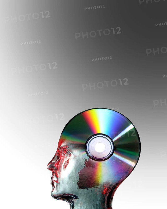 Glass head superimposed on a blank CD