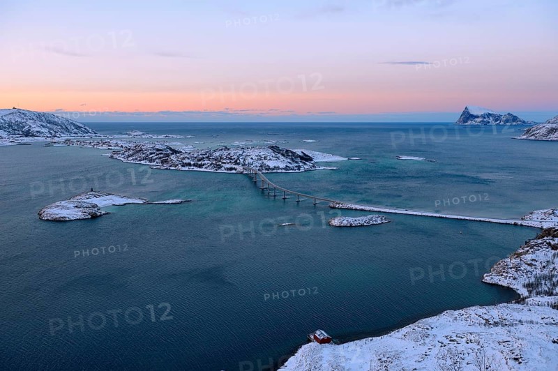 Fjord with islands and a bridge during the blue hour
