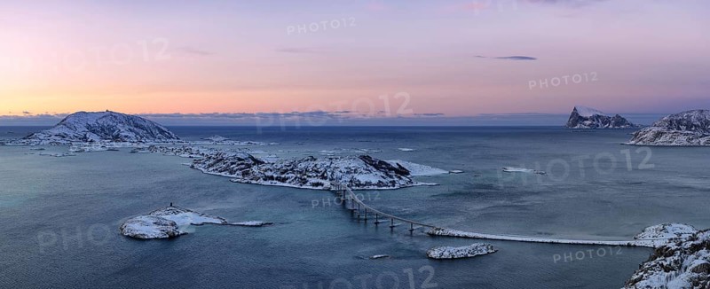 Fjord with islands and a bridge during the blue hour