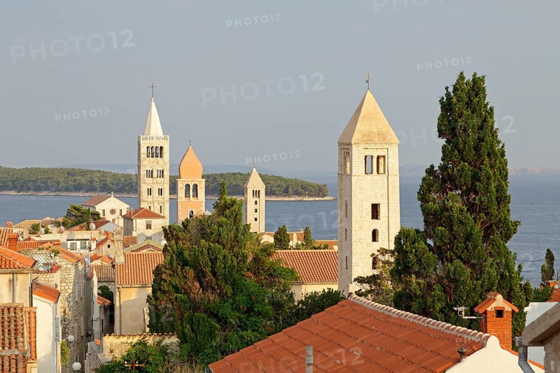Four church steeples above the roofs of the historic town centre