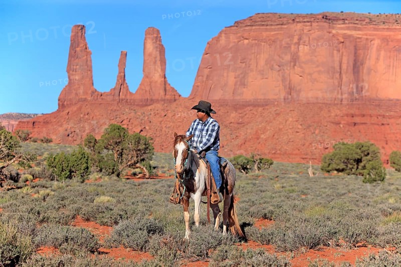 Navajo cowboy riding on a Mustang