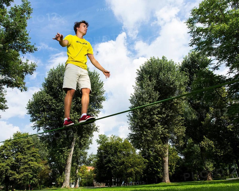 Young man balancing on a slackline