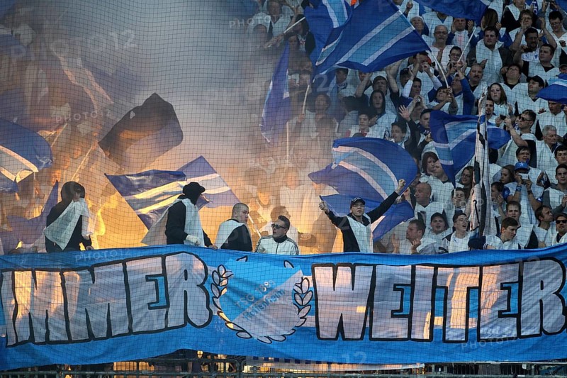 Hoffenheim fans igniting flares