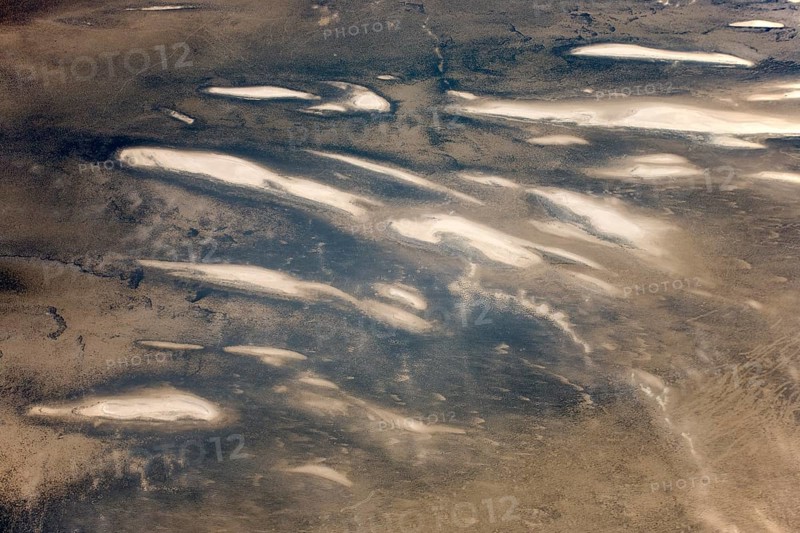 Low coastal dunes and barren desert land in the Namib Desert
