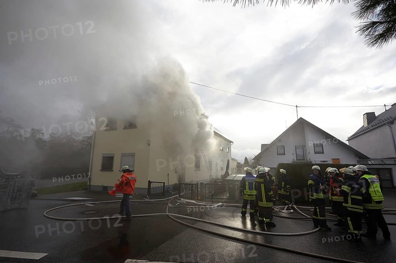 Firefighters fighting a house fire