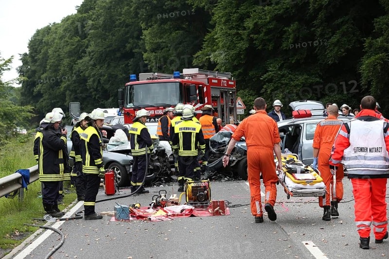Rescue workers from the fire brigade and the German Red Cross in action at a traffic accident on federal road 327