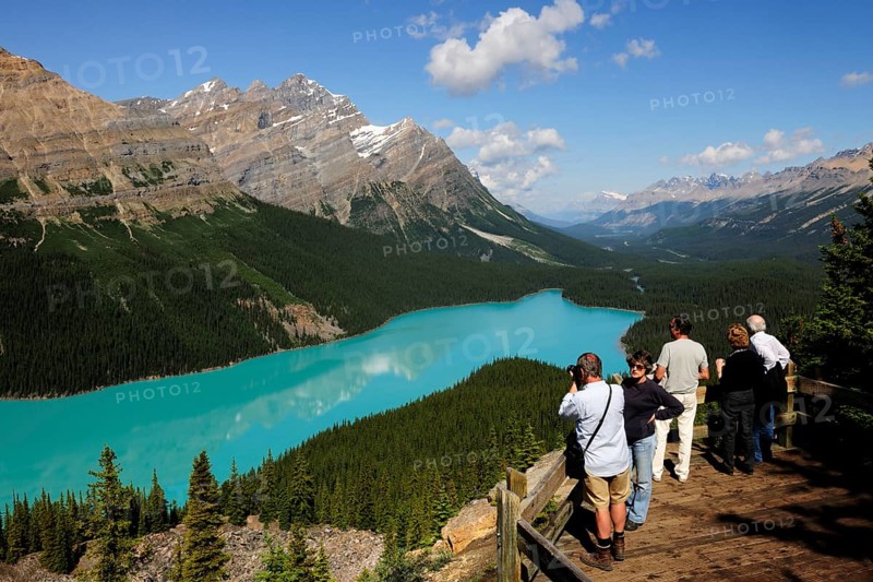 Observation platform with tourists admiring Peyto Lake in the Rocky Mountains