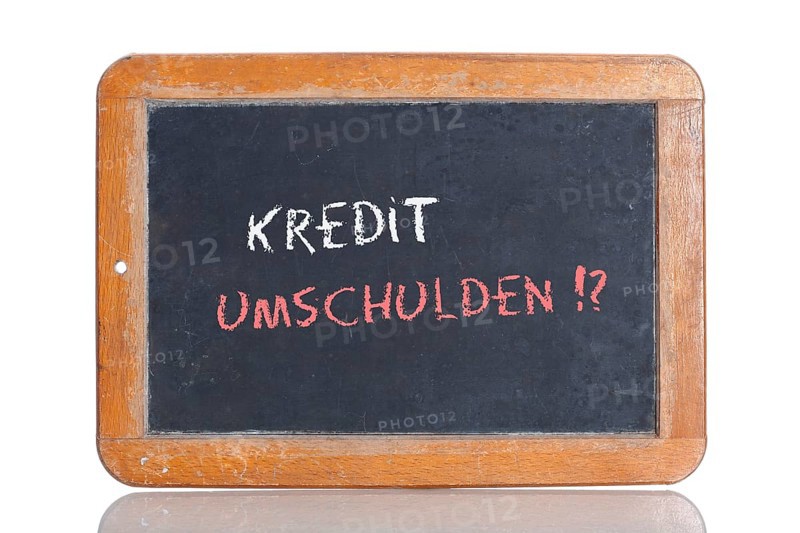 Old school blackboard with the words KREDIT UMSCHULDEN!?