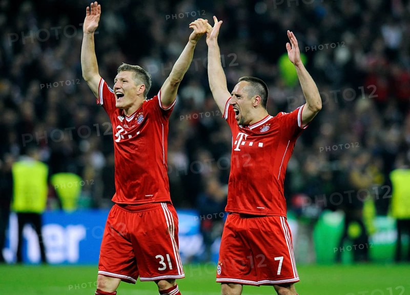 Bastian Schweinsteiger and Franck Ribery cheering jubilantly at the end of the game