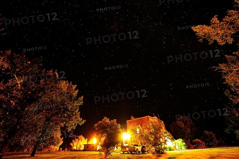 Starry sky over a small village in the middle of the prairies