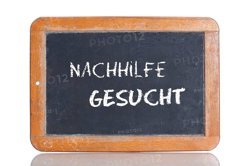 Old school blackboard with the words NACHHILFE GESUCHT