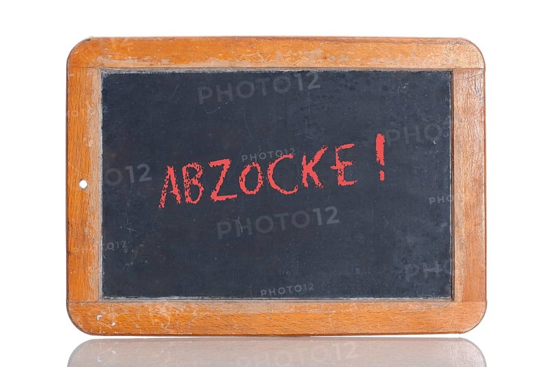 Old school blackboard with the red term ABZOCKE!