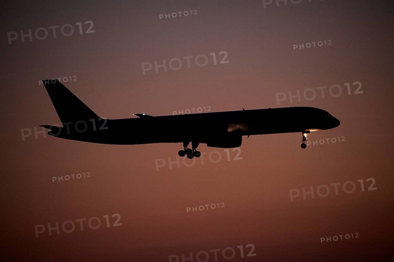 Aircraft approaching Dalaman Airport at dusk