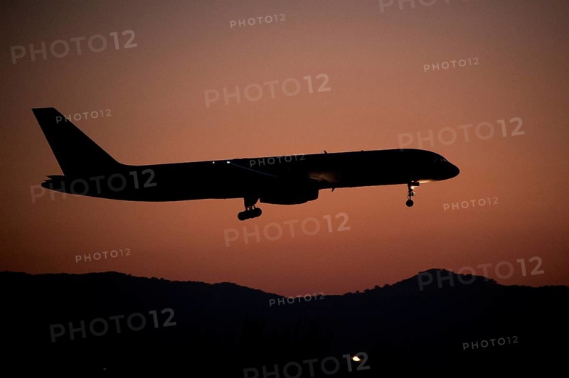 Aircraft approaching Dalaman Airport at dusk