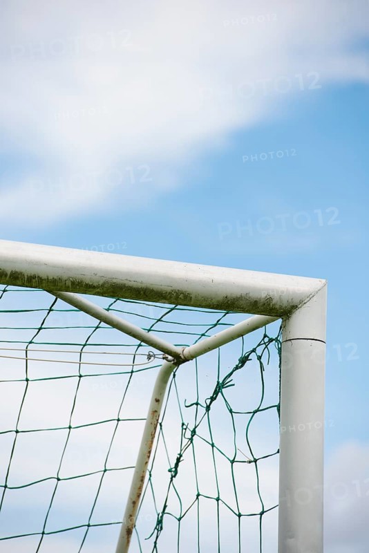 Blue sky and detail of football goal