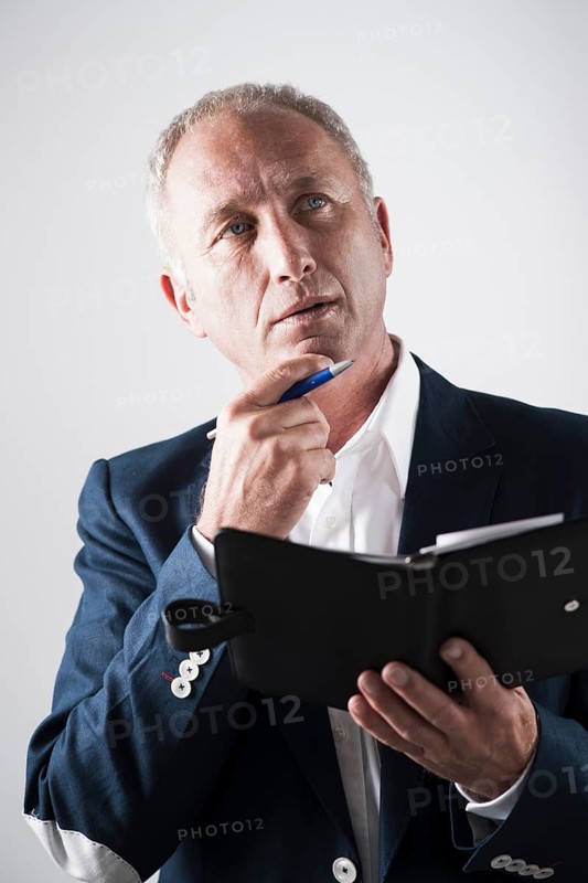 Businessman holding an appointment calendar