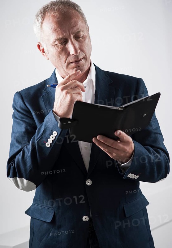 Businessman holding an appointment calendar