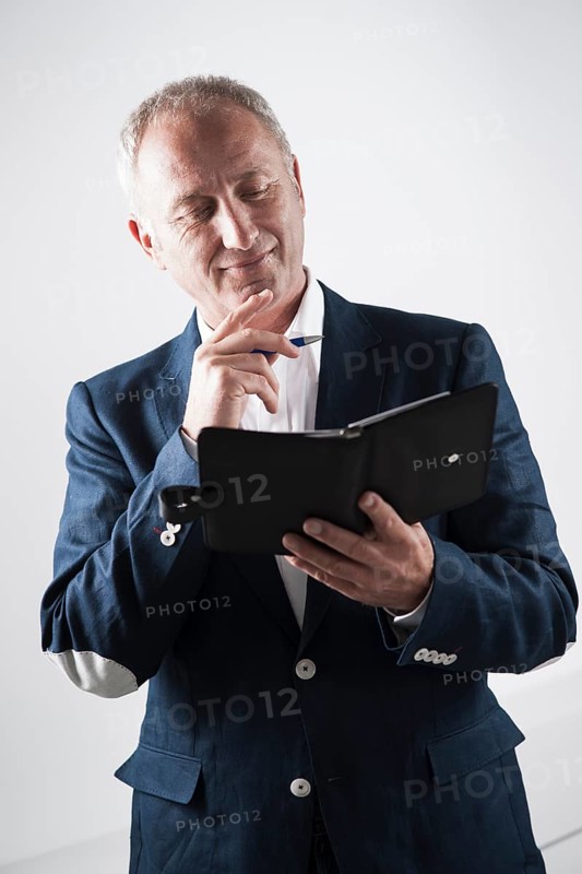 Businessman holding an appointment calendar