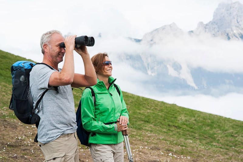 Couple enjoying the misty view while hiking