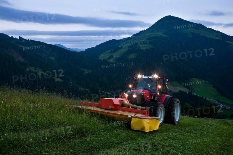 Tractor mowing hay