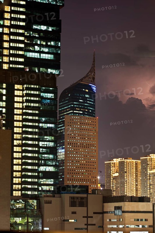 High-rise buildings in front of storm clouds