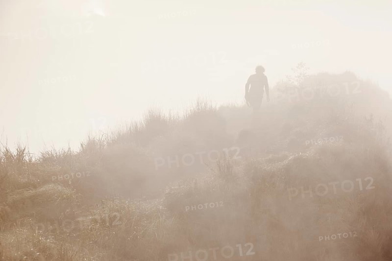 Hiker in the mist on Gunung Agung volcano