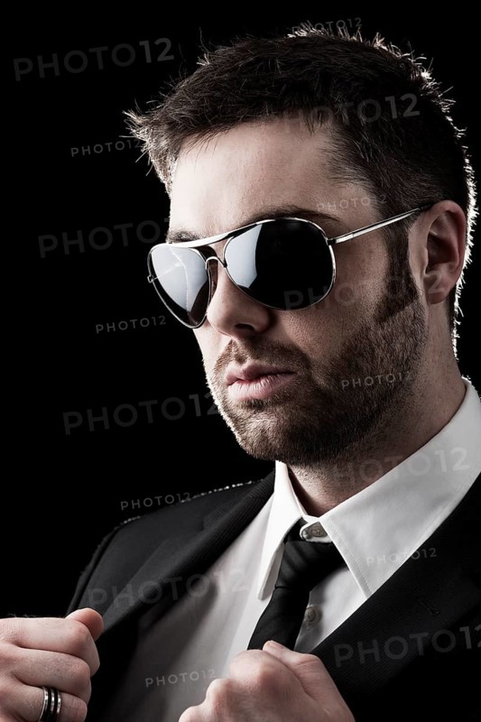 Man wearing sunglasses with stubble
