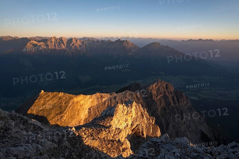 First sun rays on the peak of Serles Mountain