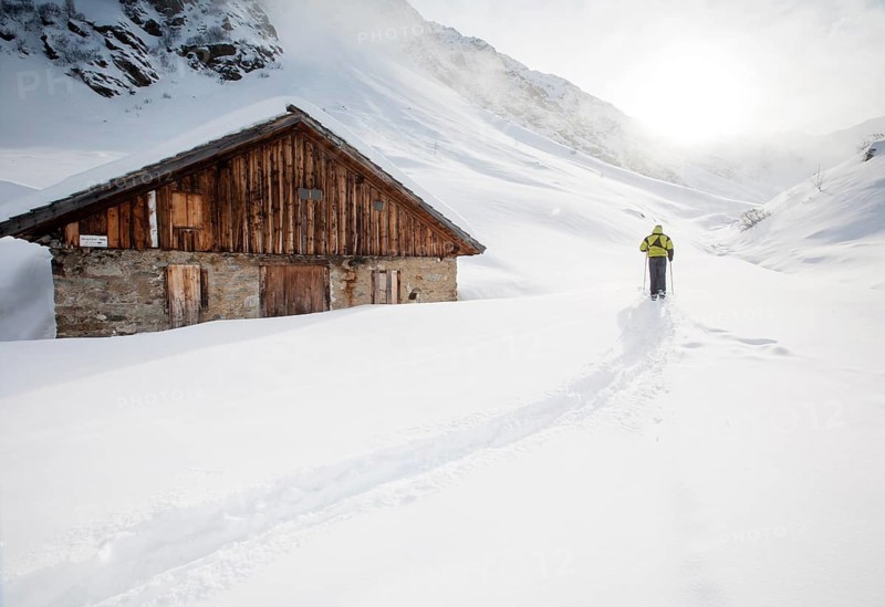 Ski walker at a mountain hut