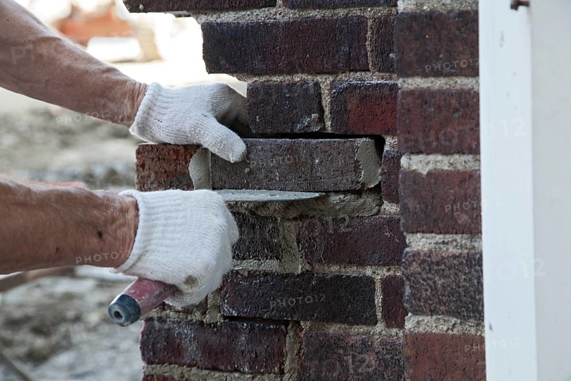 Worker renovating the historic Miller High School