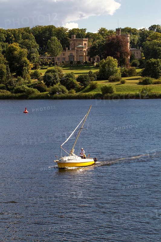 Sailboat on Lake Glienicke in front of Schloss Babelsberg Castle