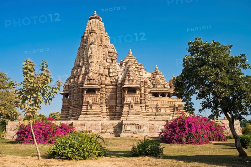 Hindu temple with flowering bougainvillea bushes