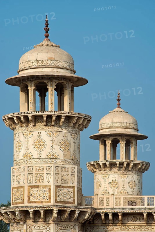 Towers with intricate marble inlays of an Islamic mausoleum
