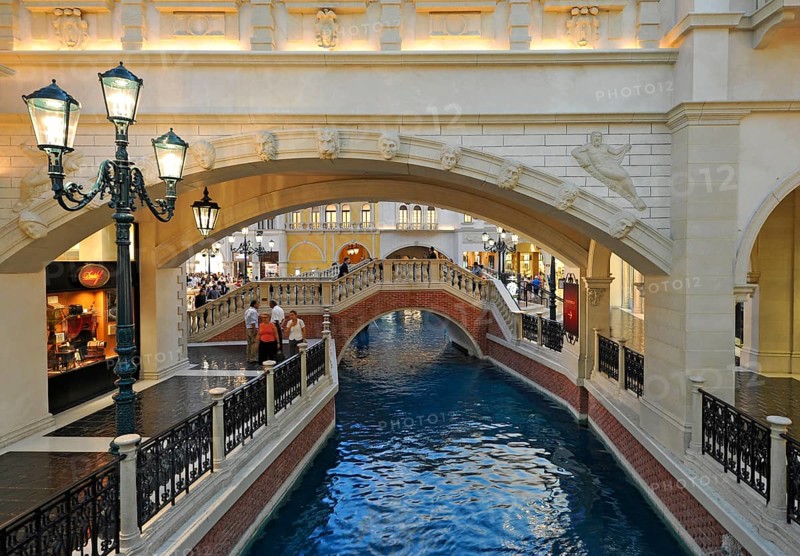 Tourists in a replica of Venetian streets under an artificial sky