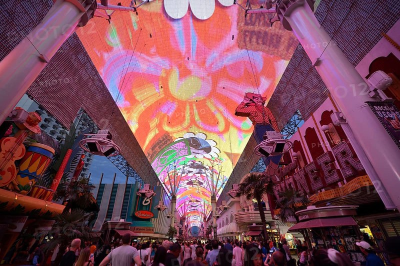Tourists marvelling at the laser show in the neon dome of the Fremont Street Experience in old Las Vegas